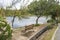 Empty wooden park bench overlooking Viroi lake