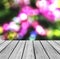 Empty Wooden Perspective Platform with Sparkling Abstract Rainbow Blur Bokeh used as Template to Mock up for Display Product