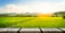 Empty wooden photo frame on farm background