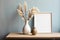 Empty Wooden Picture Frame. Framework. Vase with pampas grass.