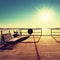 Empty wooden pier at beautiful colorful morning. Tourist wharf in sea bay.