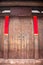 The empty wooden Plaque and Spring Festival couplets without text on the traditional chinese wooden door with brass handle