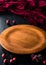 Empty wooden plate on a black table with a napkin, Round tray for pizza on dark wooden table