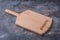Empty wooden serving board for pizza, copy space
