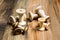 Empty wooden sewing spools on old wood background