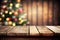 Empty wooden table with blured christmas background