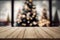 Empty wooden table with blured christmas background