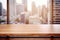 Empty wooden table with blurred a city view and natural morning sunlight reflection background.