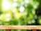 Empty wooden table and blurred garden bokeh light background. Mo