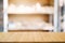 Empty wooden table with blurred tools shelf background