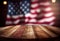 Empty wooden table with with blurred USA flag background