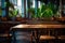 Empty wooden table and chair in coffee shop or restaurant blurred background