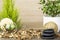 Empty wooden table decorated with organic things, stones, plants