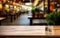 Empty wooden table in front of blurred background of shopping mall atrium can be used for display or montage your products