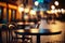 Empty wooden table on outdoor cafe and chair with blurred nigh city and boke