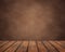 Empty wooden table of planks on a brown grunge background. countertop, work surface