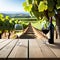 An empty wooden table for product blurred french vineyard in the