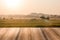 Empty wooden table ricefield and sunrise background