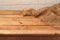 Empty wooden table with sackcloth. Kitchen background