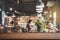 Empty wooden table space platform and blurry defocused restaurant
