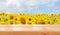 Empty wooden table on sunflower field background. Ready for product montage. Mockup. Banner.Copy space