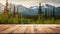 The empty wooden table top with blur background of Alaska nature. Exuberant.