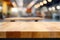 Empty wooden table top with canteen cafeteria foodcourt blurred background. Template for product presentation