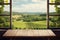 Empty wooden table top, vineyard view out of open window