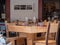 Empty Wooden Tables with Crystal Wine tasting Glasses Set for Outdoor Lunch in a Tuscan Village in Italy