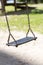 Empty wooden traditional swing on playground