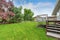 Empty Wooden walkout deck overlooking backyard garden