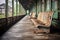 empty, worn out wooden train station benches