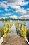 Empty yellow boat landing pier jetty at dutch sluis, Maas river - Sambeek sluice, Netherlands