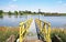 Empty yellow boat landing pier jetty at dutch sluis, Maas river - Sambeek sluice, Netherlands