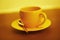 Empty yellow coffee cup