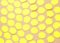 Empty yellow speech bubbles on beige background. Abstract texture of small paper stickers