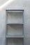 empty zinc shelf with concrete wall background