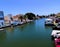 Empuriabrava, Spain Catalonia - June 23, 2022: Beautiful blue channels with boats at the largest residential marina of Europe