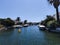 Empuriabrava, Spain - June 23, 2022: Beautiful blue channels with beautiful boats at the largest residential marina of Europe