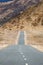 Emty road vanishing into HImalayas mountains in Ladakh, Northern India