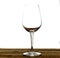 Emty wine glass on wood table. Isolate on white background