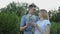 Enamored guy and girl blow flowers dandelions