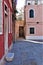 Enchanting corner in pink, lights and ancient buildings in Venice city, Italy