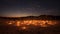 Enchanting Desert Night: Roman Candles Illuminating the Sandscape