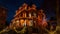 Enchanting Holiday Grandeur: Mesmerizing Nighttime Photo of Victorian Mansion\\\'s Decorated Entrance