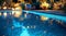An enchanting image of a clean pool illuminated by soft lighting, with reflections dancing on the water\\\'s surface