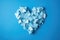 An enchanting image of a heart design meticulously arranged on a cool blue surface, radiating feelings of love, serenity