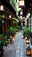 Enchanting lantern lit courtyard with lush greenery, colorful flowers, and traditional charm