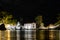 Enchanting Night View of Holy Mary Island in Parga Greece. White Chapel with Belfry Surrounded by Big Trees. Night Photography