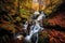 Enchanting waterfall in a mystical forest with vibrant autumn leaves